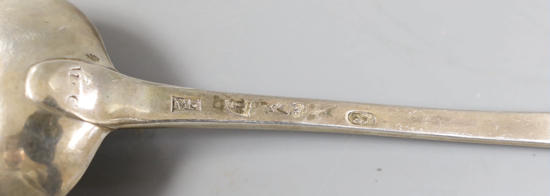 A pair of George II Irish silver bright cut engraved basting spoons, Michael Smith, Dublin, 1754 & 1757, 31.8cm, 6.3oz.